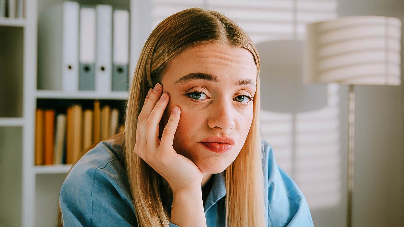 Unimpressed woman deciding to ghost someone. 