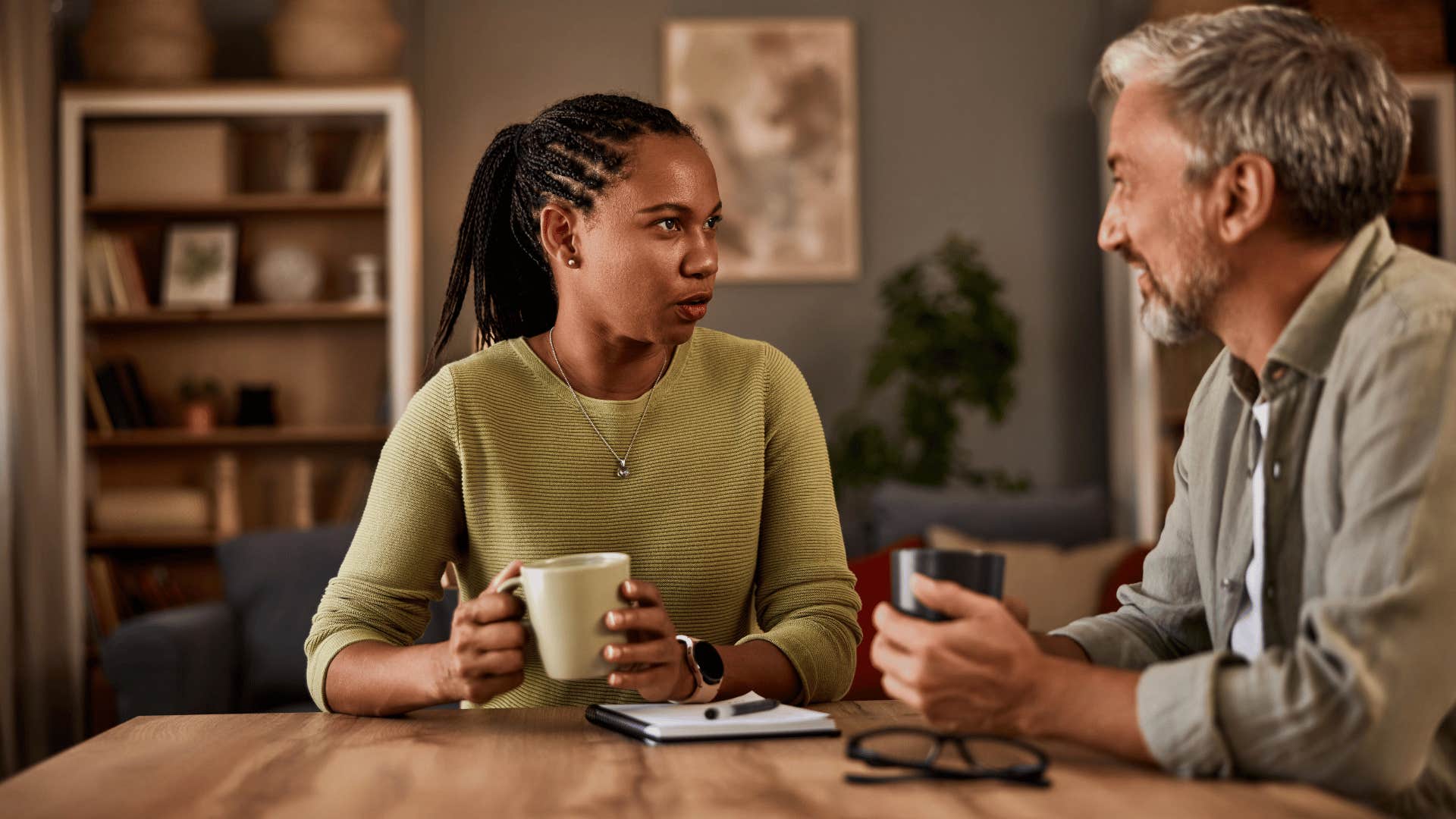 man and woman talking over coffee