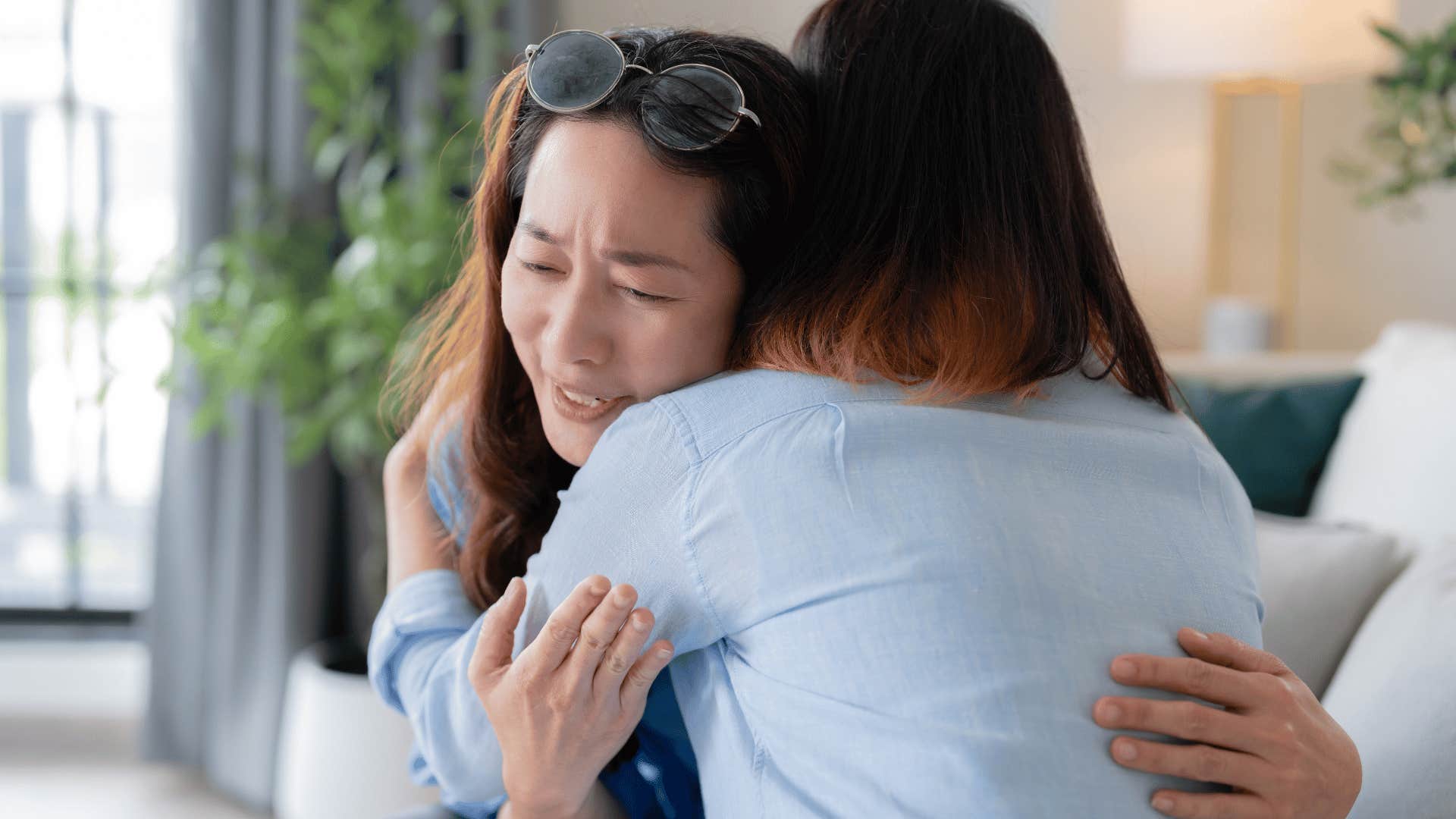 two women hugging 