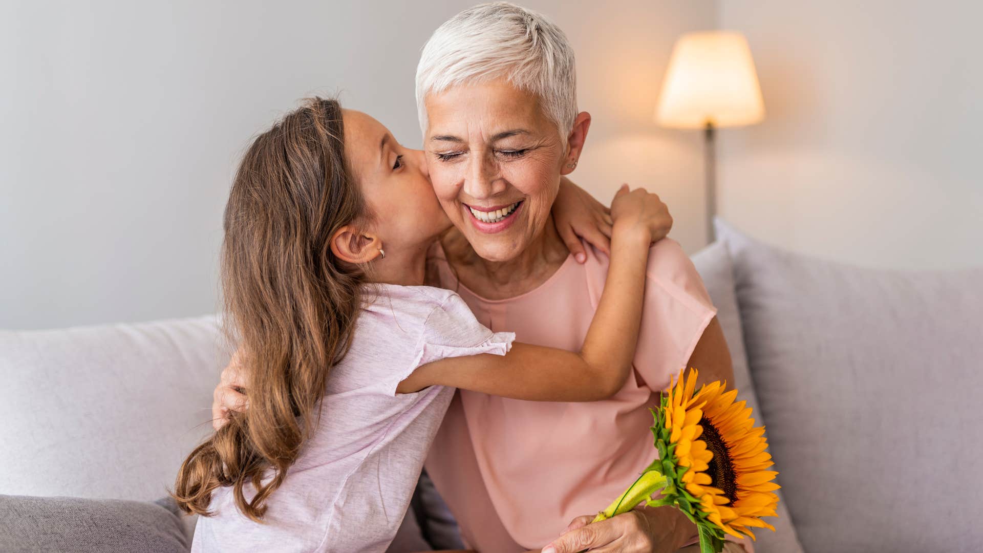 Young girl hugging her grandma. 