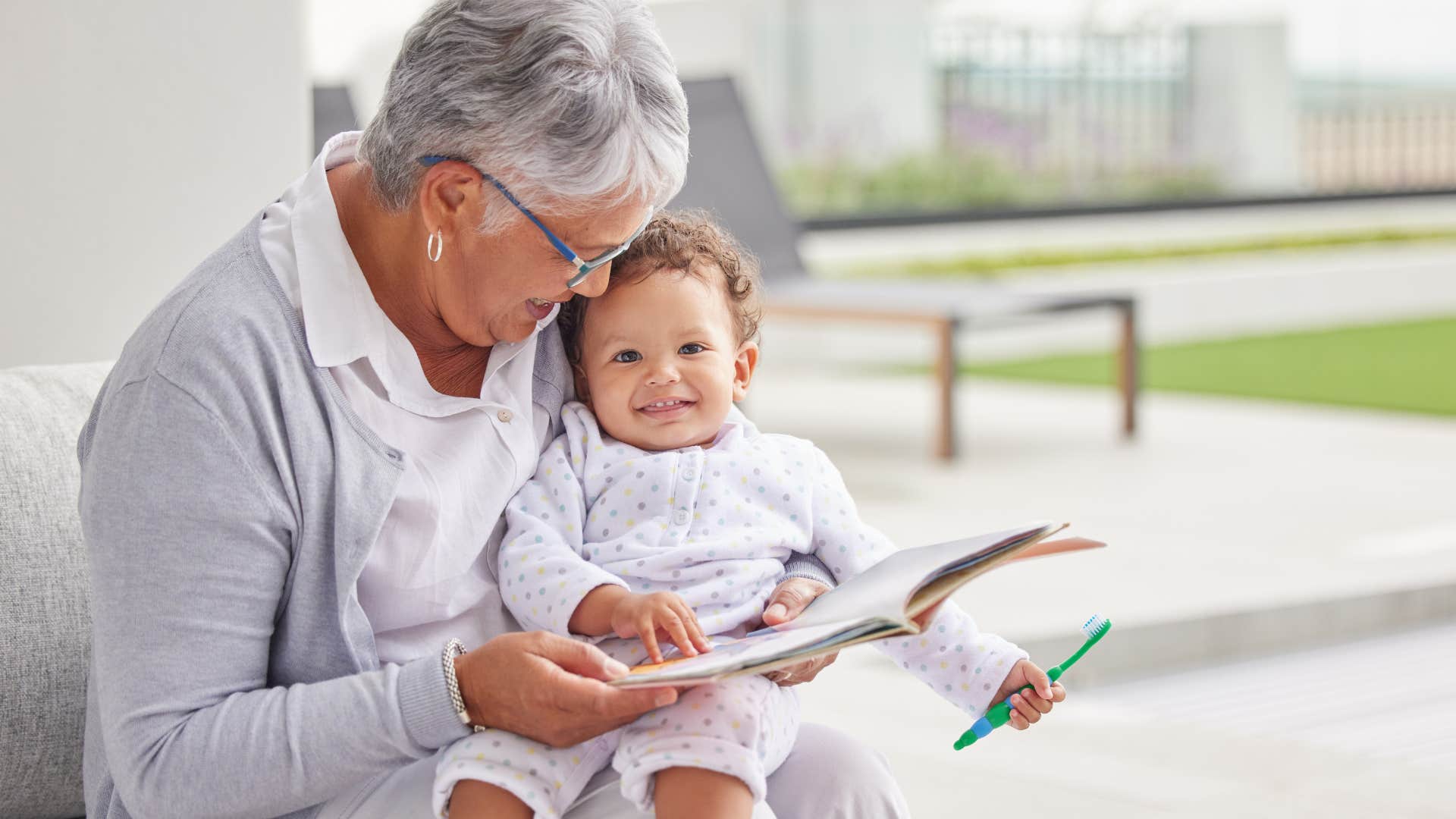 Grandma reading to her young grandchild.