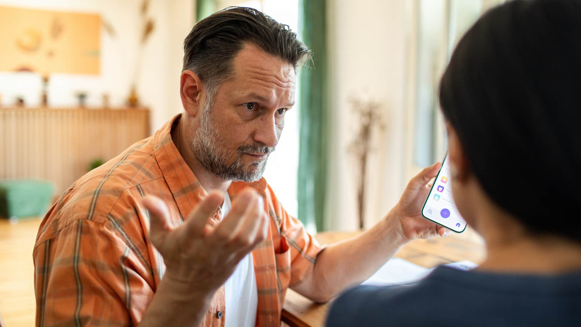 emotionally stunted man looking upset talking to a woman