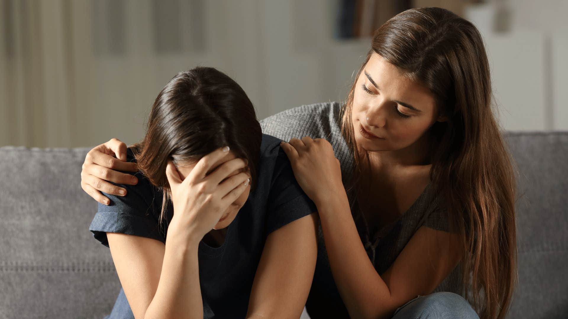 woman comforting friend 