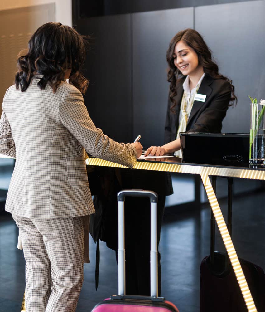 woman checking in to a hotel