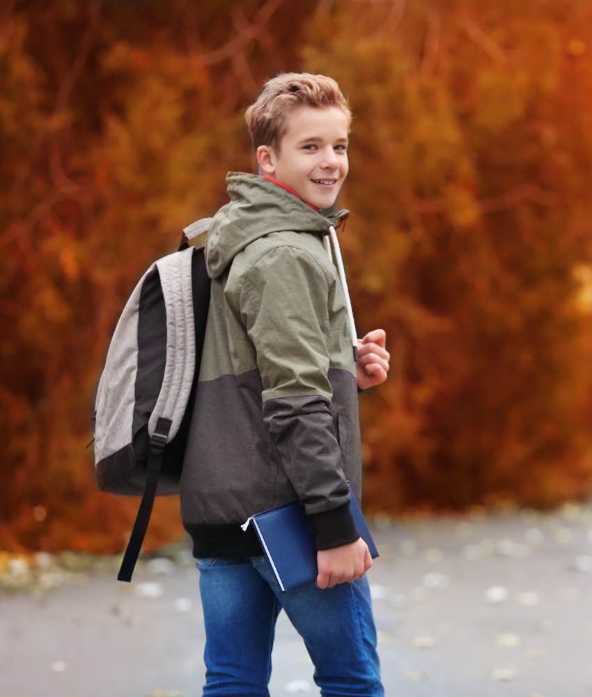 tween boy walking down the street