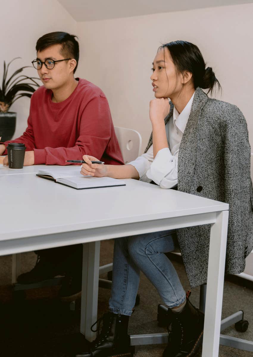 two professionals actively listening to someone