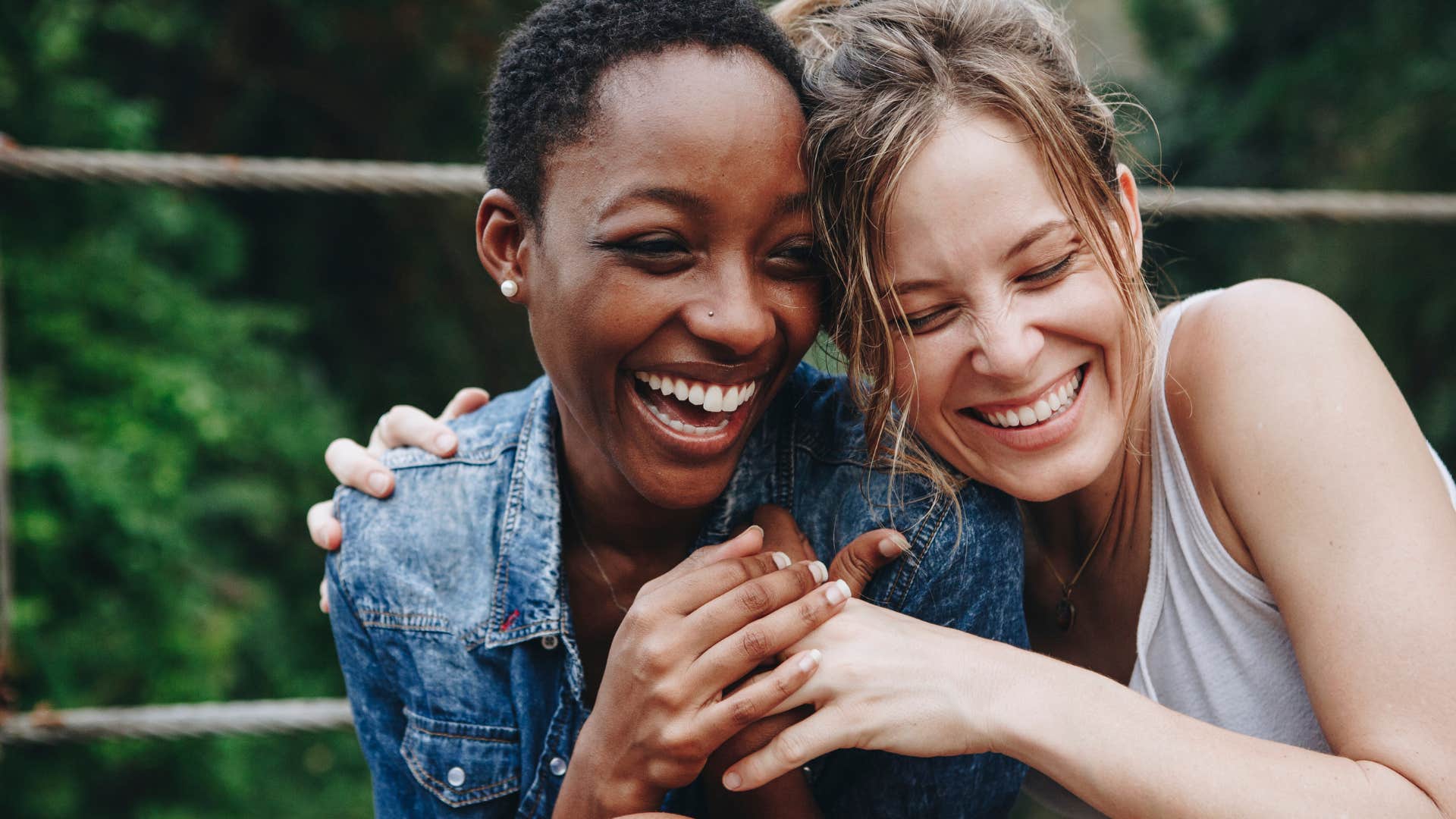 Women smiling and hugging each other