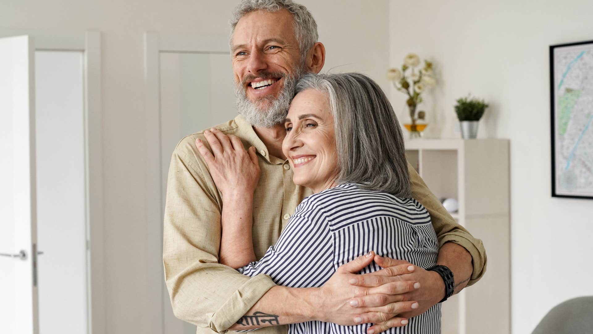 Older couple smiling and hugging each other