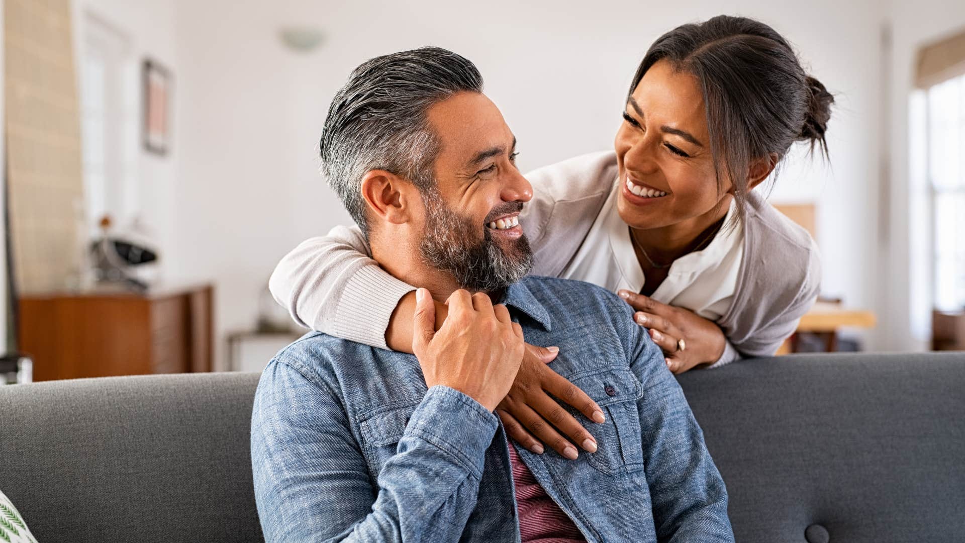 Woman smiling and hugging her partner