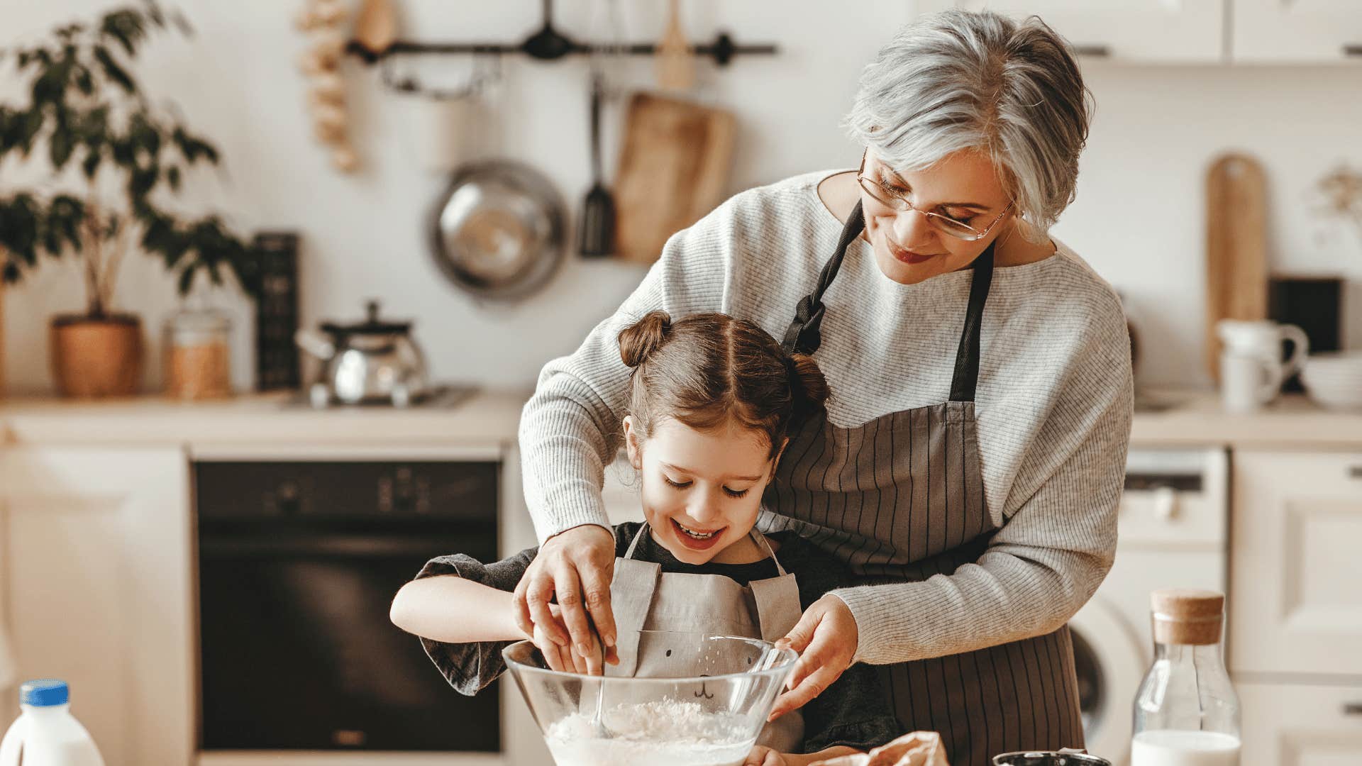 grandma and granddaughter baking 