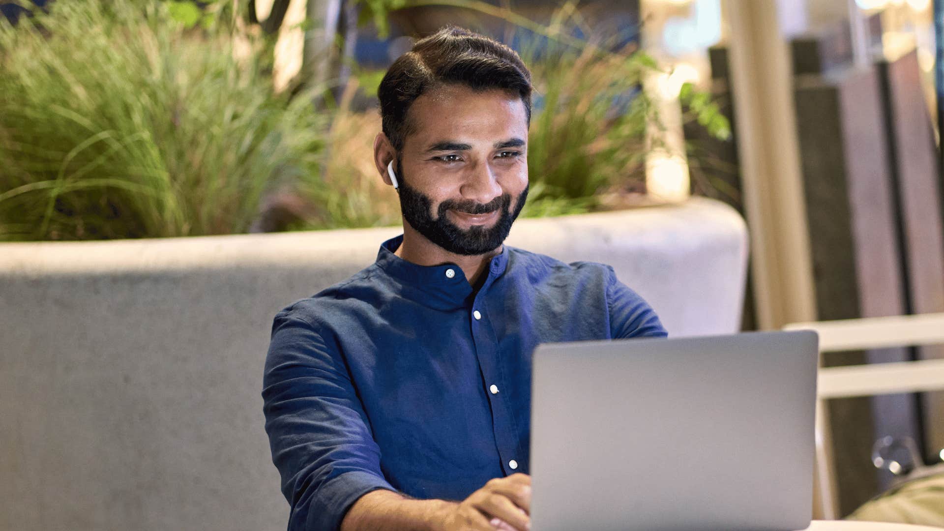 Man works intently at computer