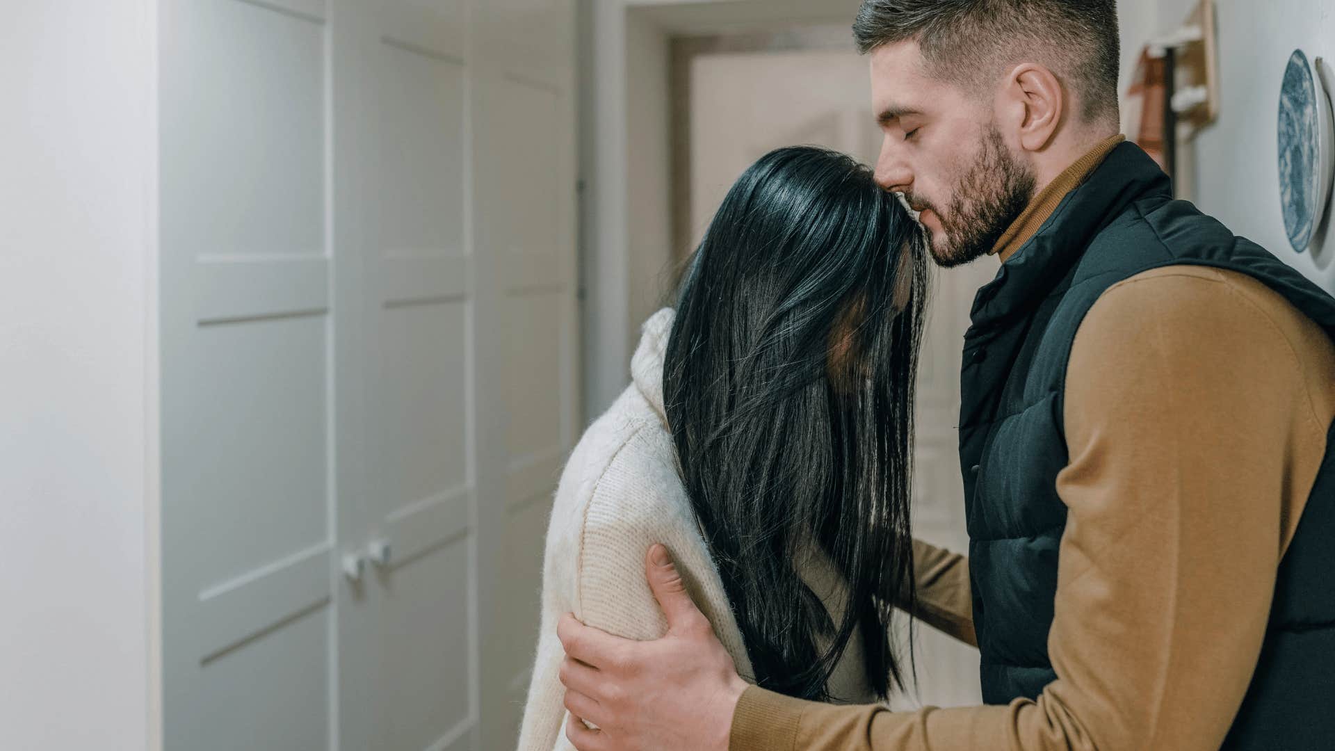 woman resting her head against man