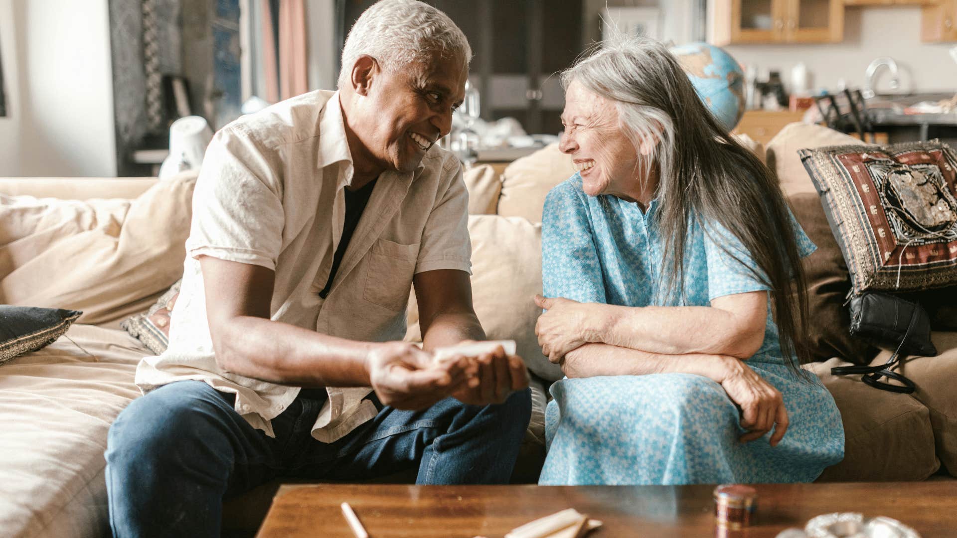 couple laughing on couch