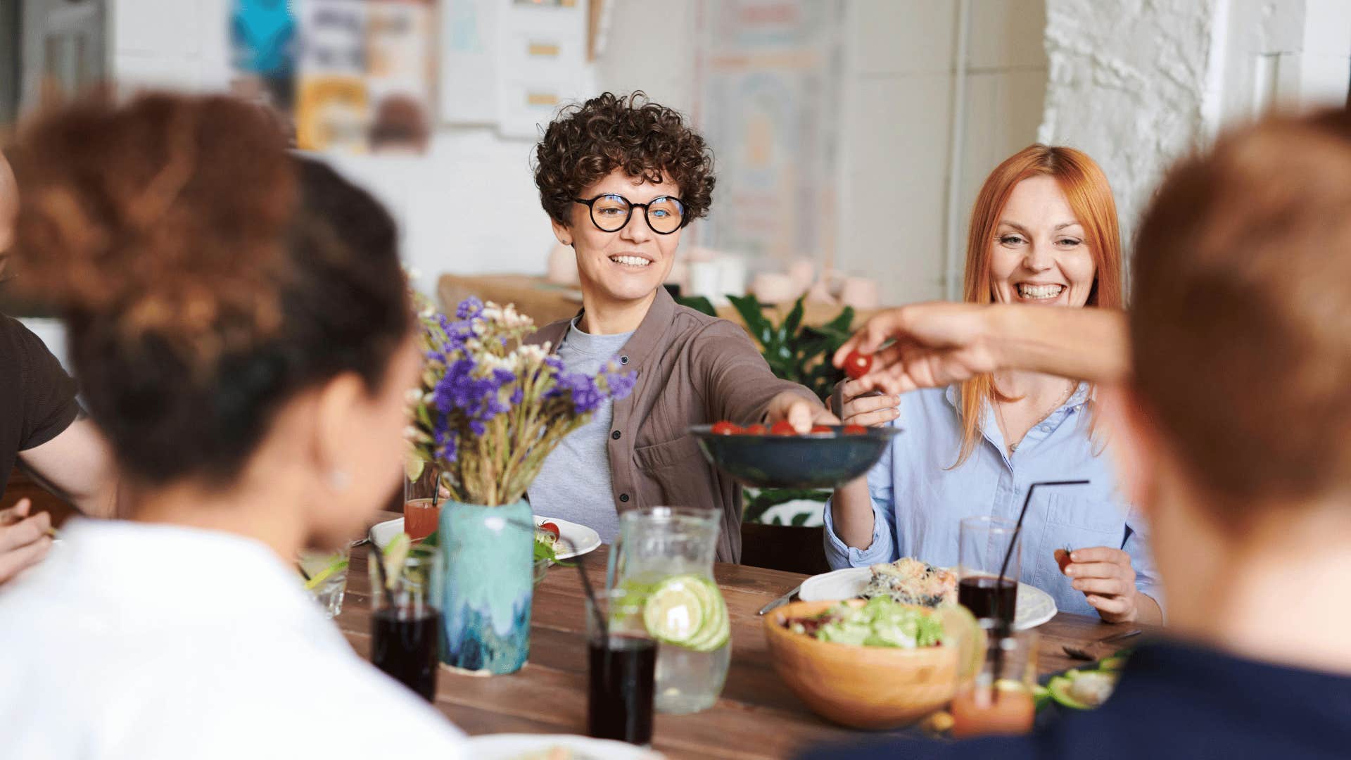 people sitting down and sharing a meal