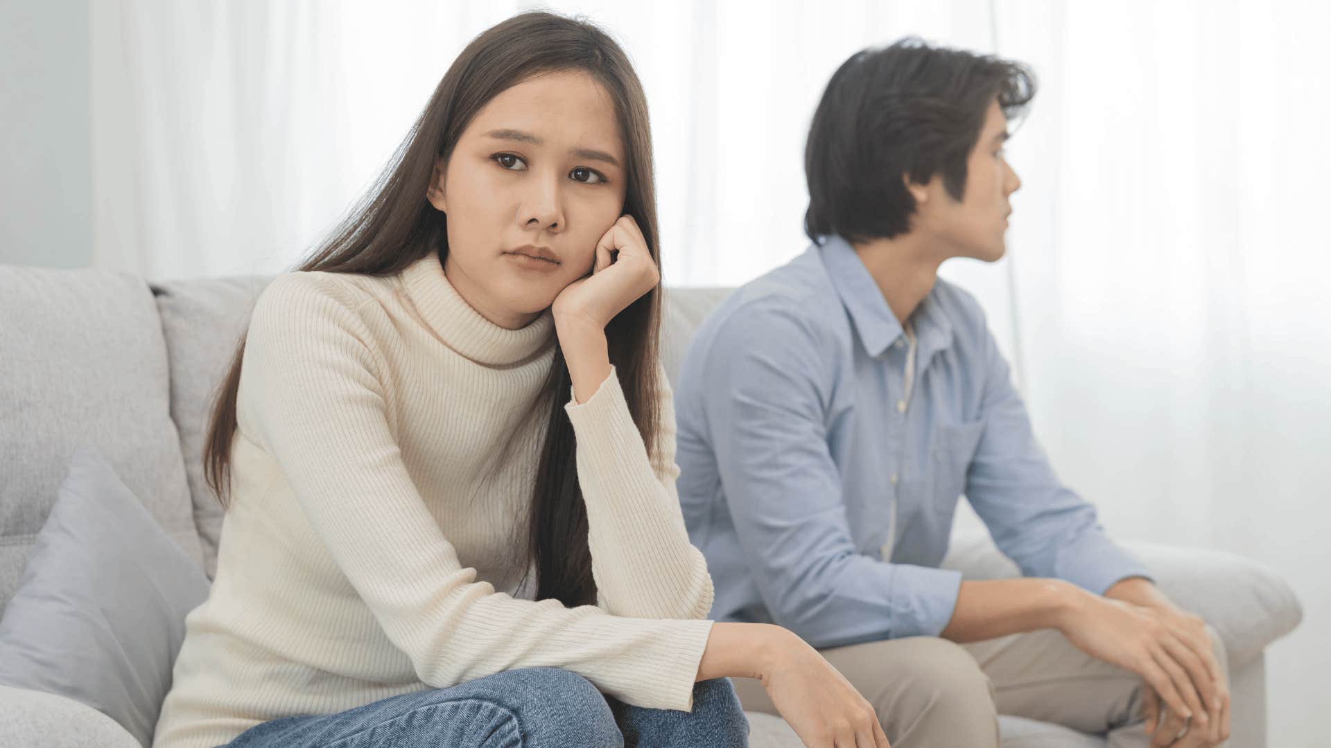 woman and man ignoring each other