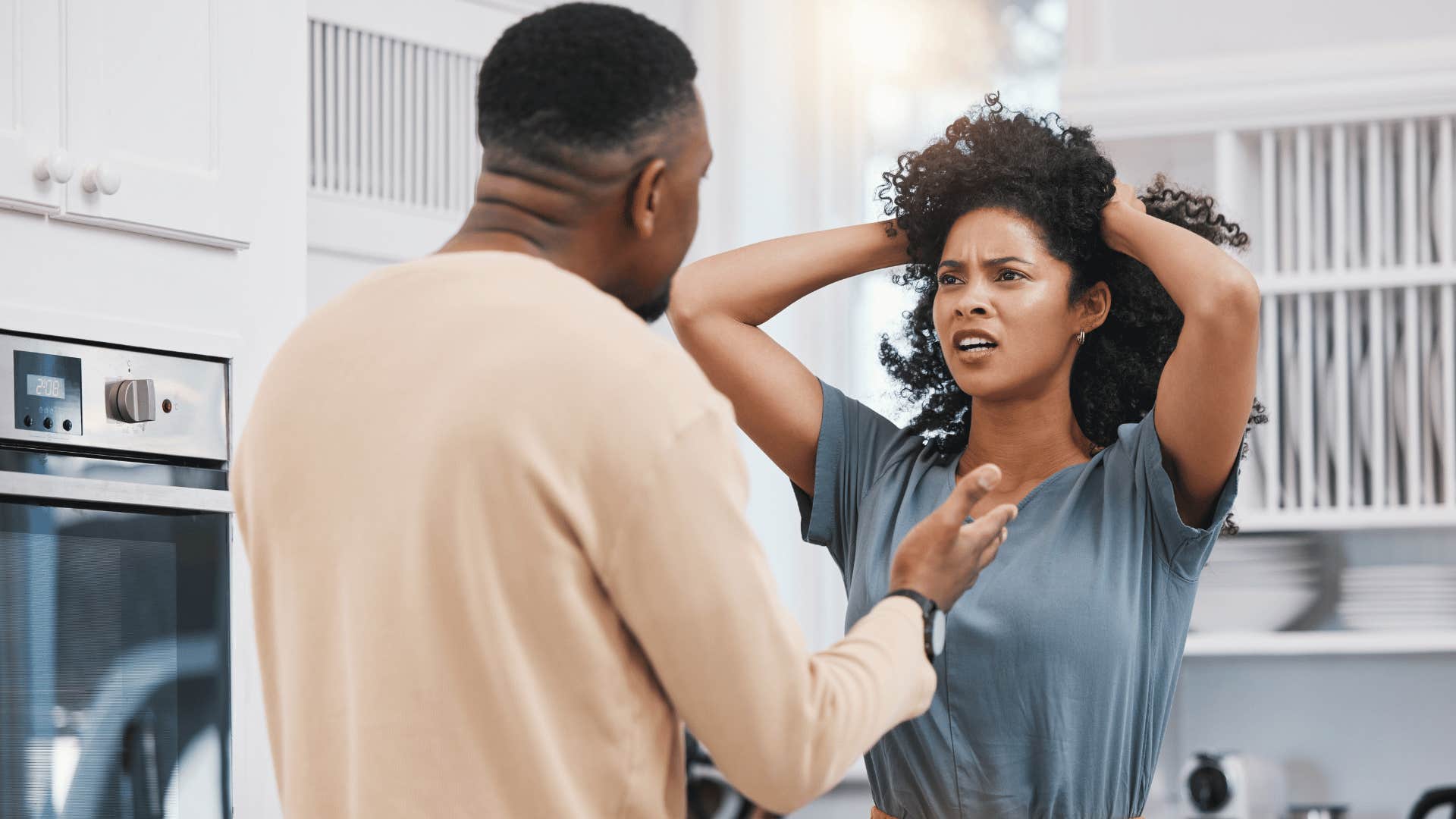 couple fighting in kitchen