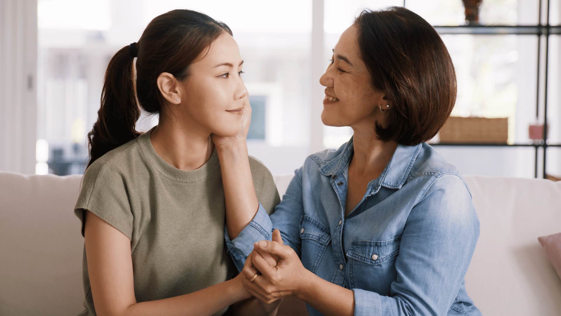 mother comforting daughter