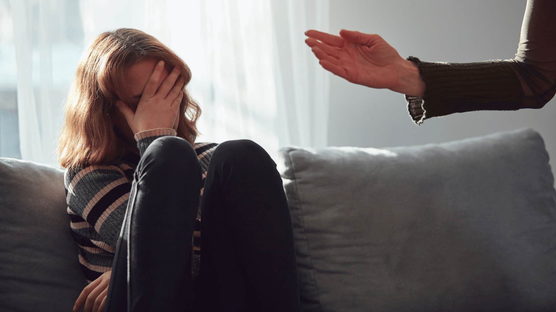 mother yelling at distraught daughter