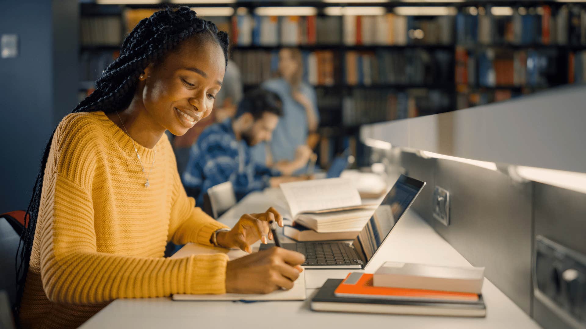 young woman working late on assignment