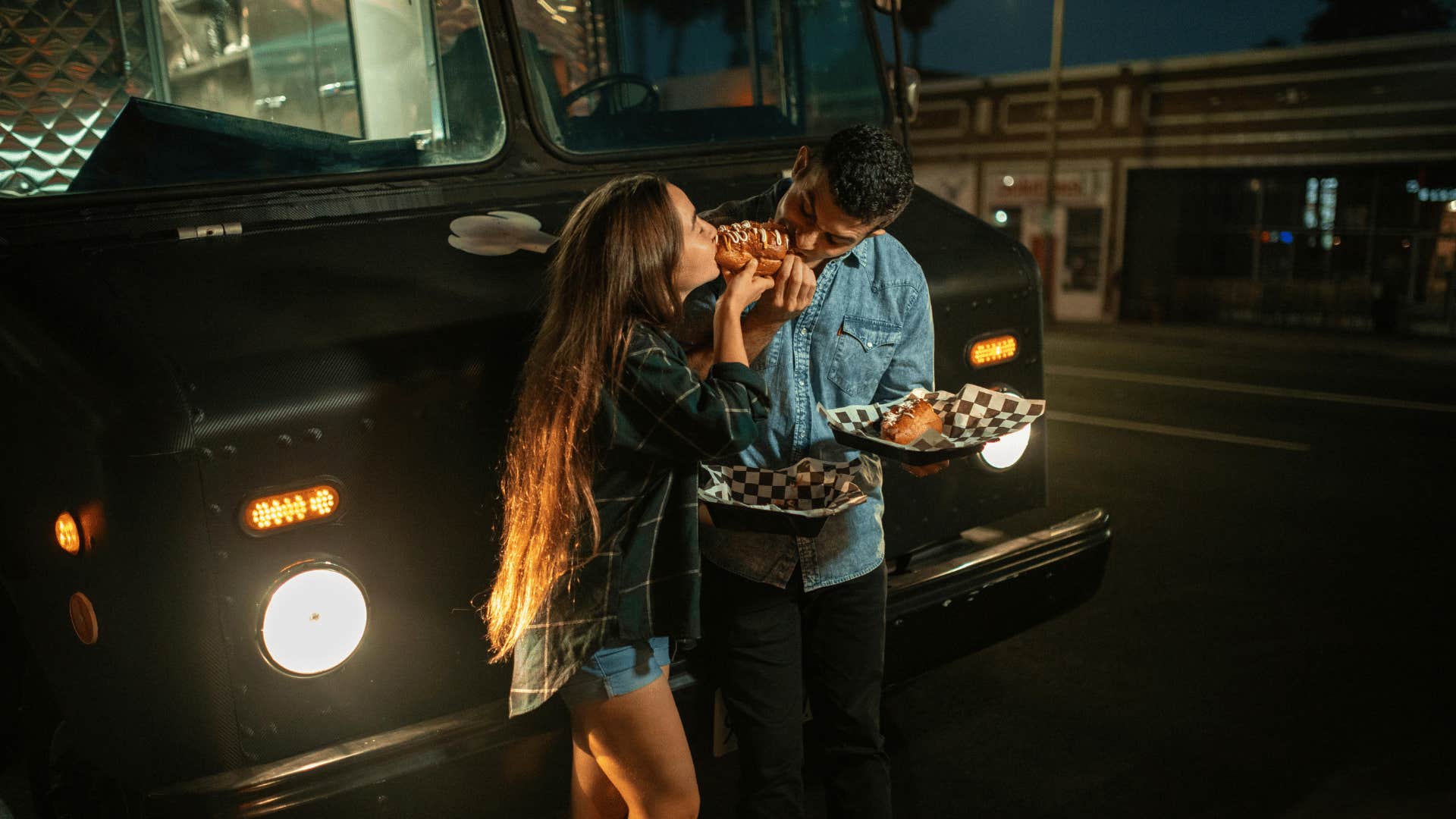 couple sharing food outside