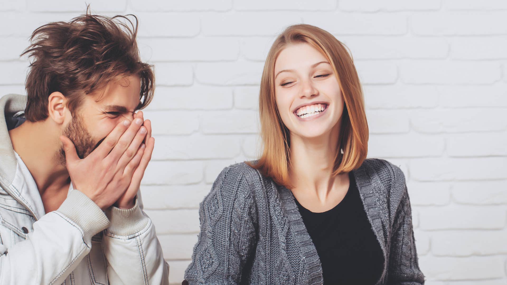 laughing couple becoming more attractive to each other