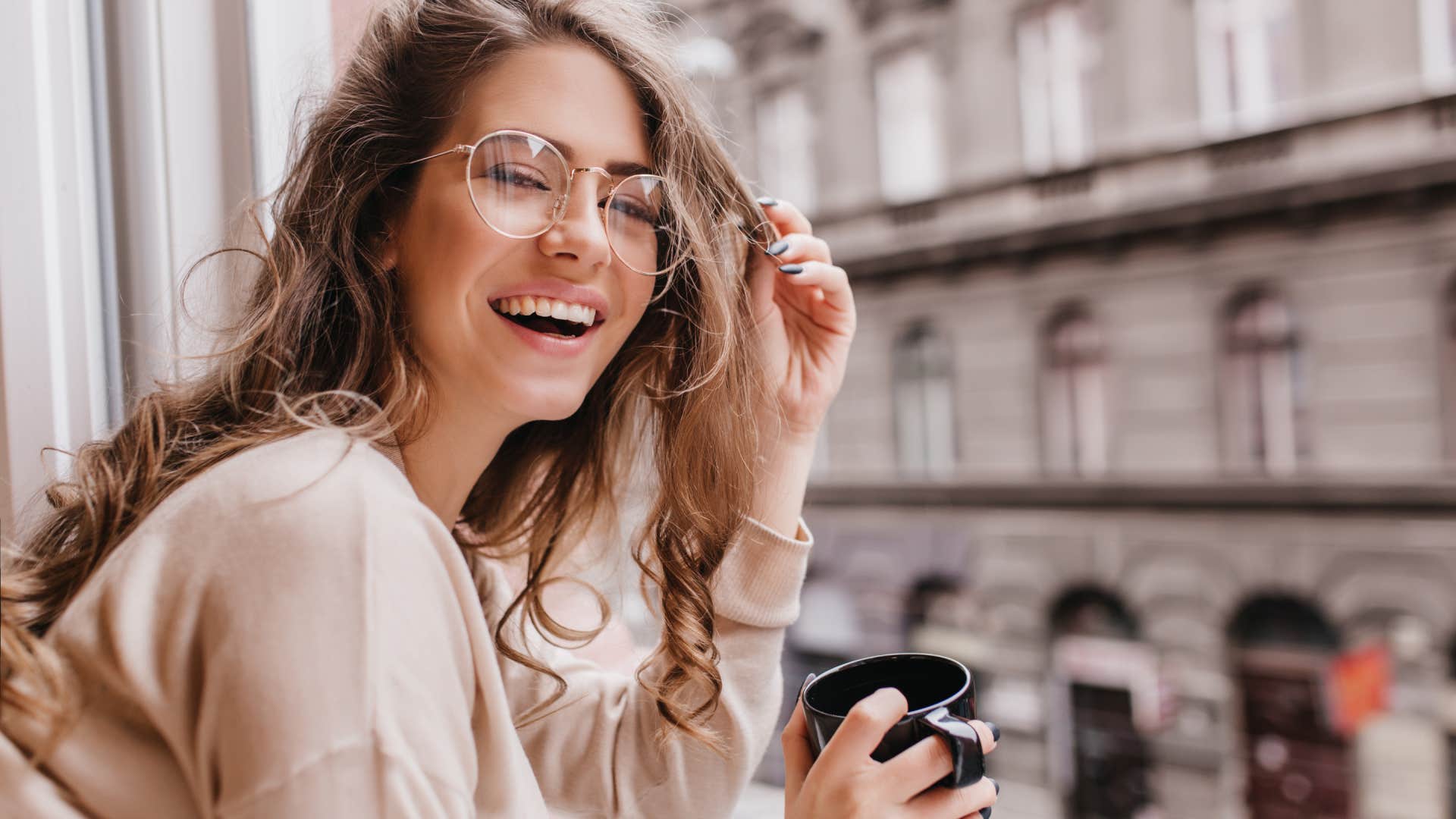 woman laughing and feeling less stressed