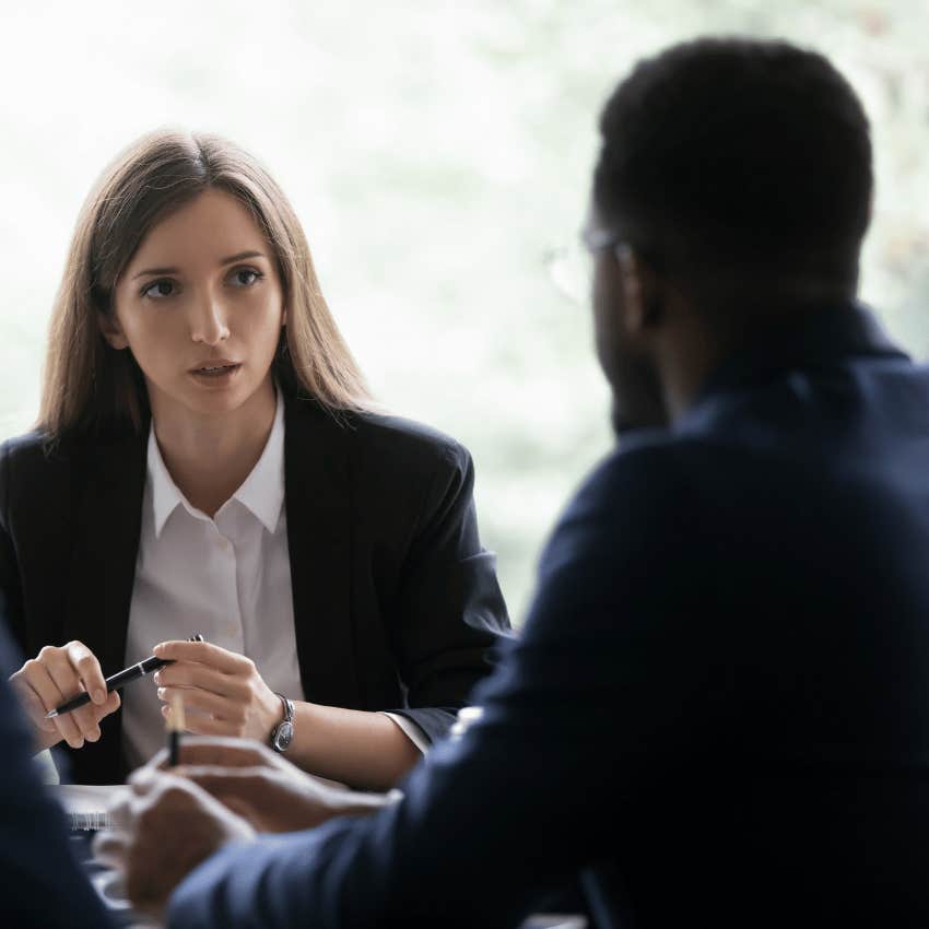 woman with a blank face staring at a man