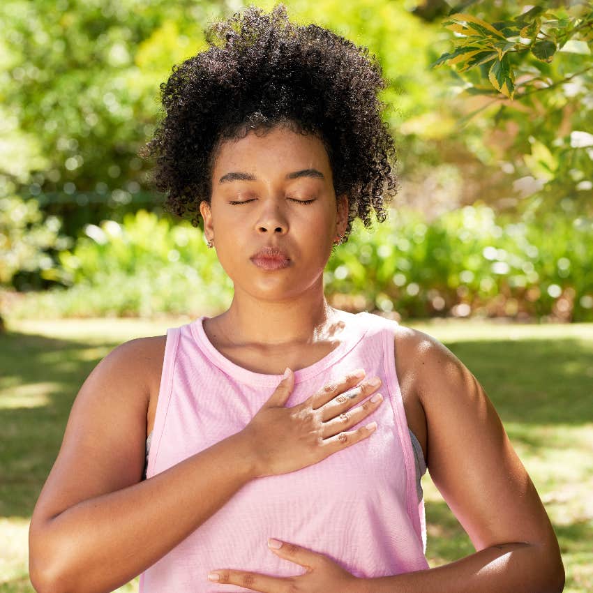 Woman using deep breathing exercises to be less passive-agressive