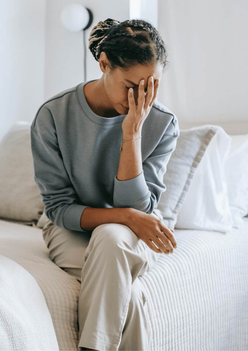 woman in despair with her face in her hand