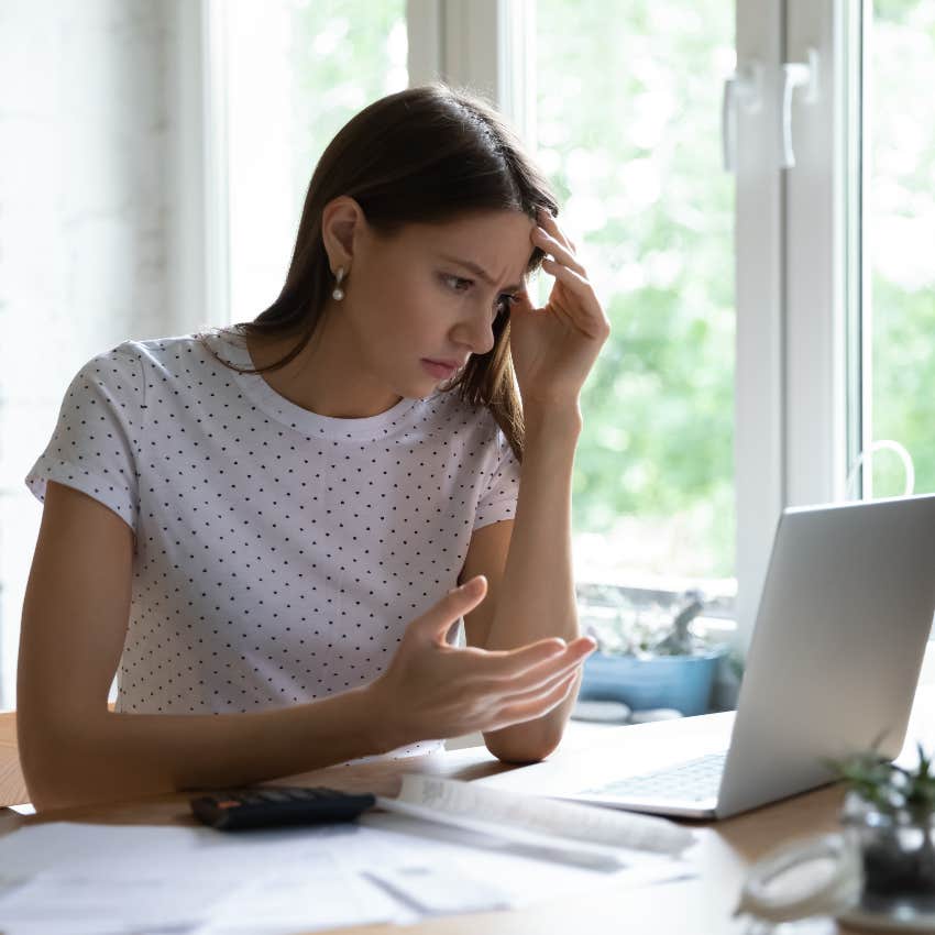 Woman finding out she's in debt