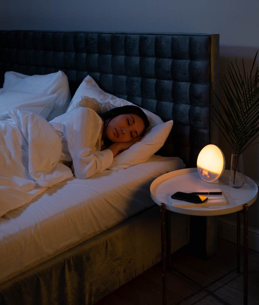 Woman sleeping soundly with nightlight 