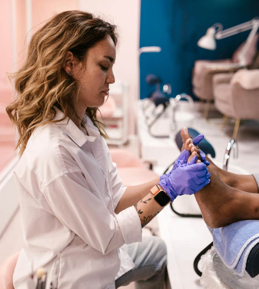 woman giving another woman a pedicure