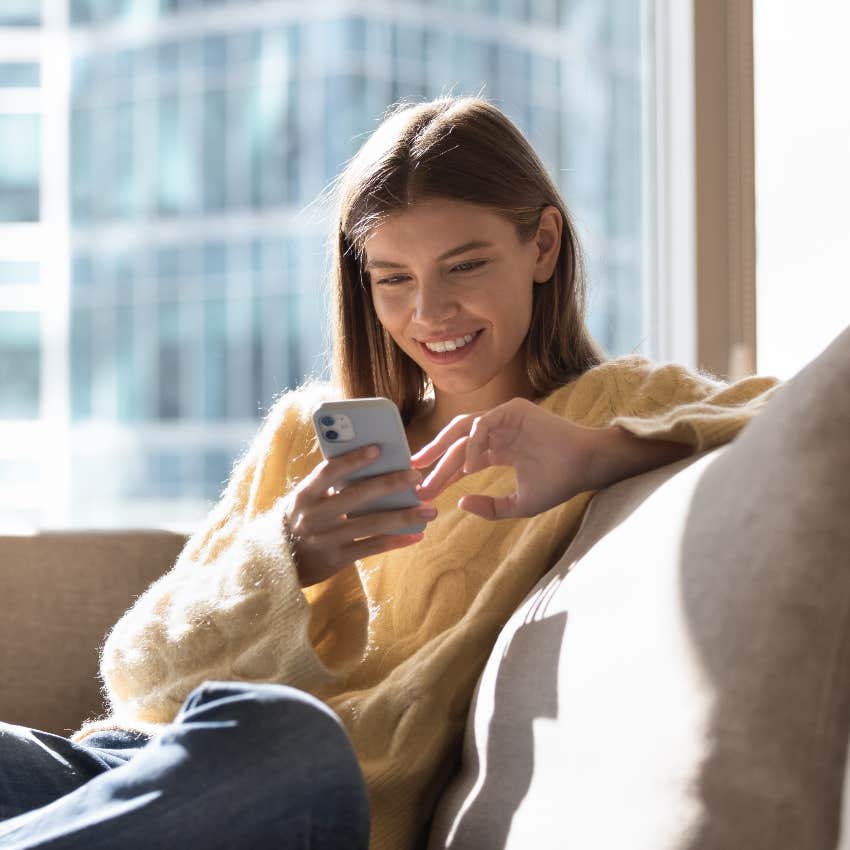 Woman examining online dating profile to start a conversation