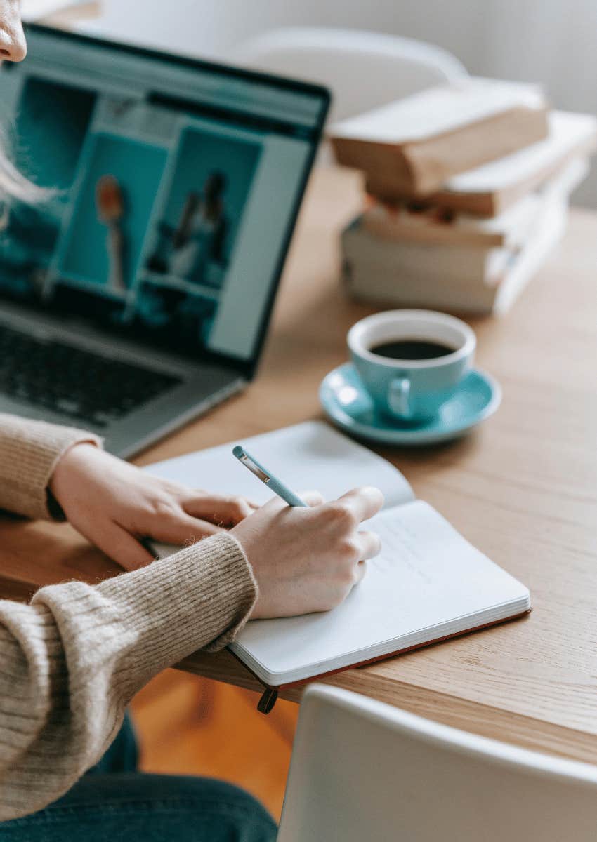 woman researching and taking notes