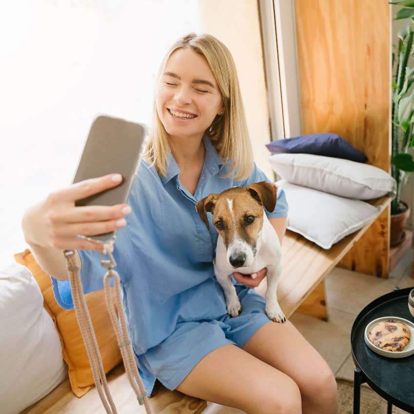 Woman using her dog to start a conversation