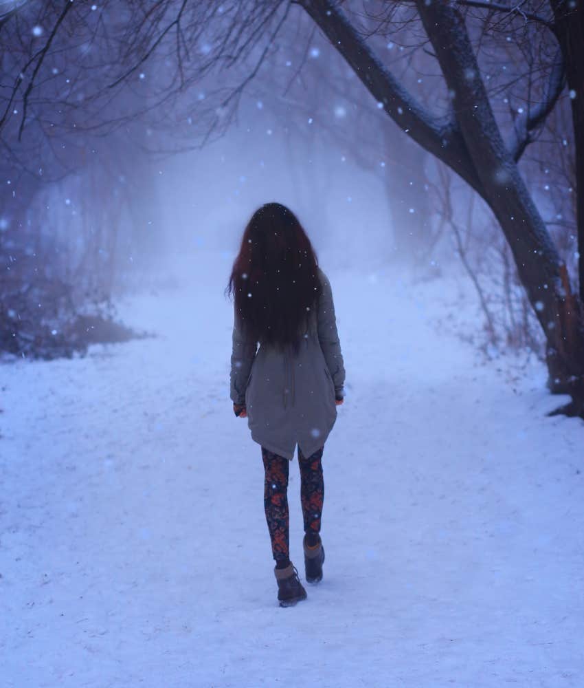 woman walking during blue light hour of dusk