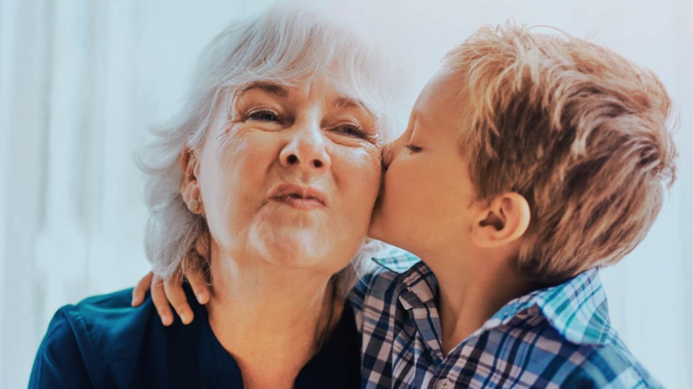 grandson kissing grandma on cheek