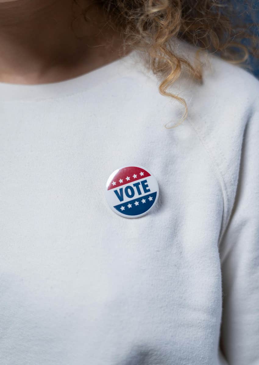 woman wearing a vote sticker