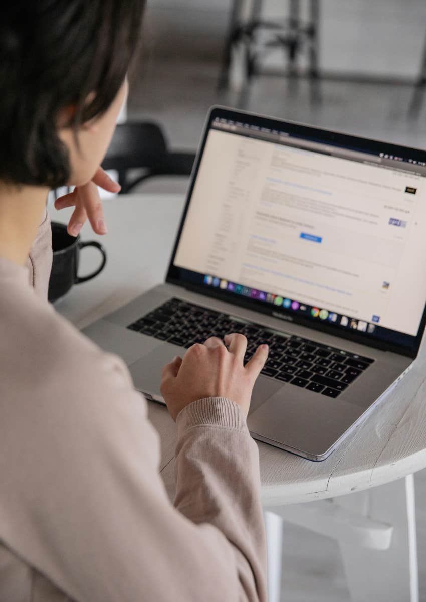 female employee on laptop at desk