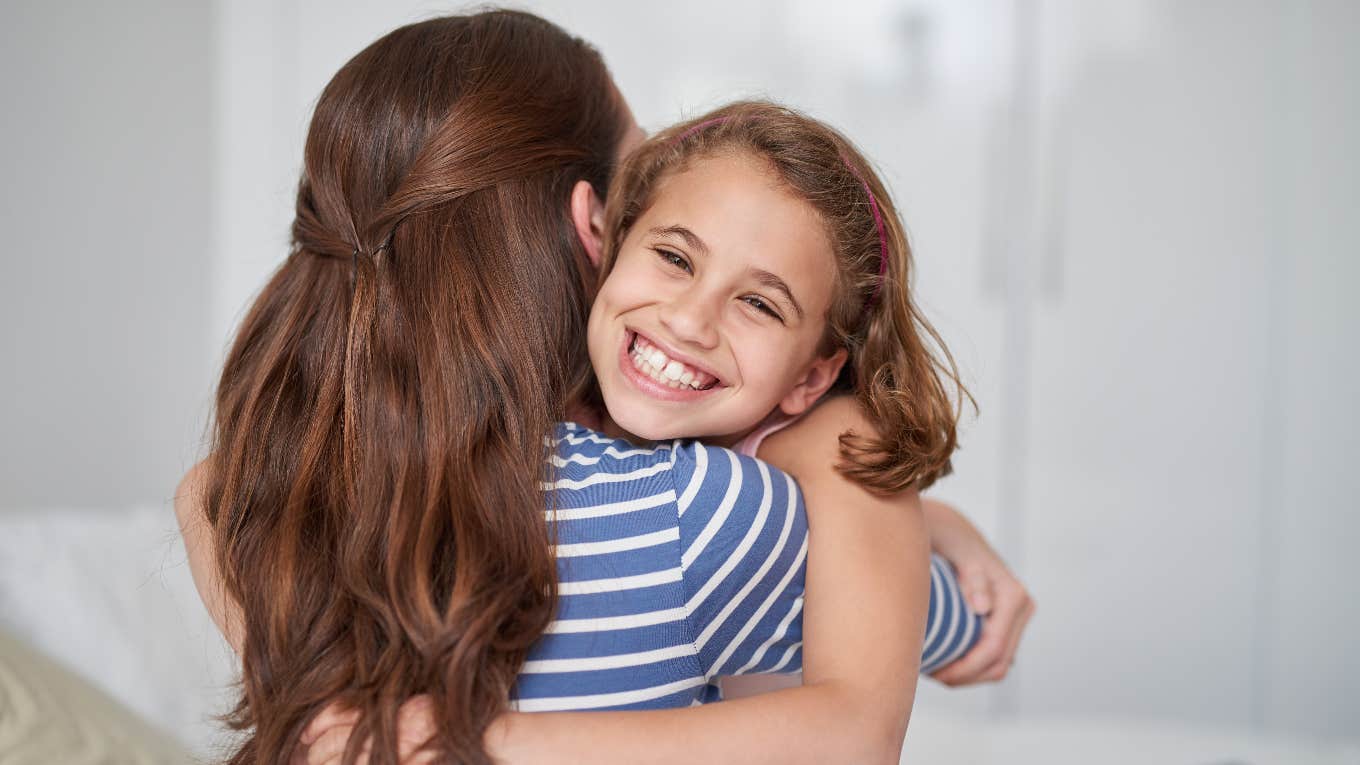 Mom hugging "weird" daughter