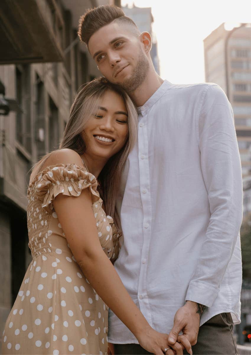 young couple hugging close