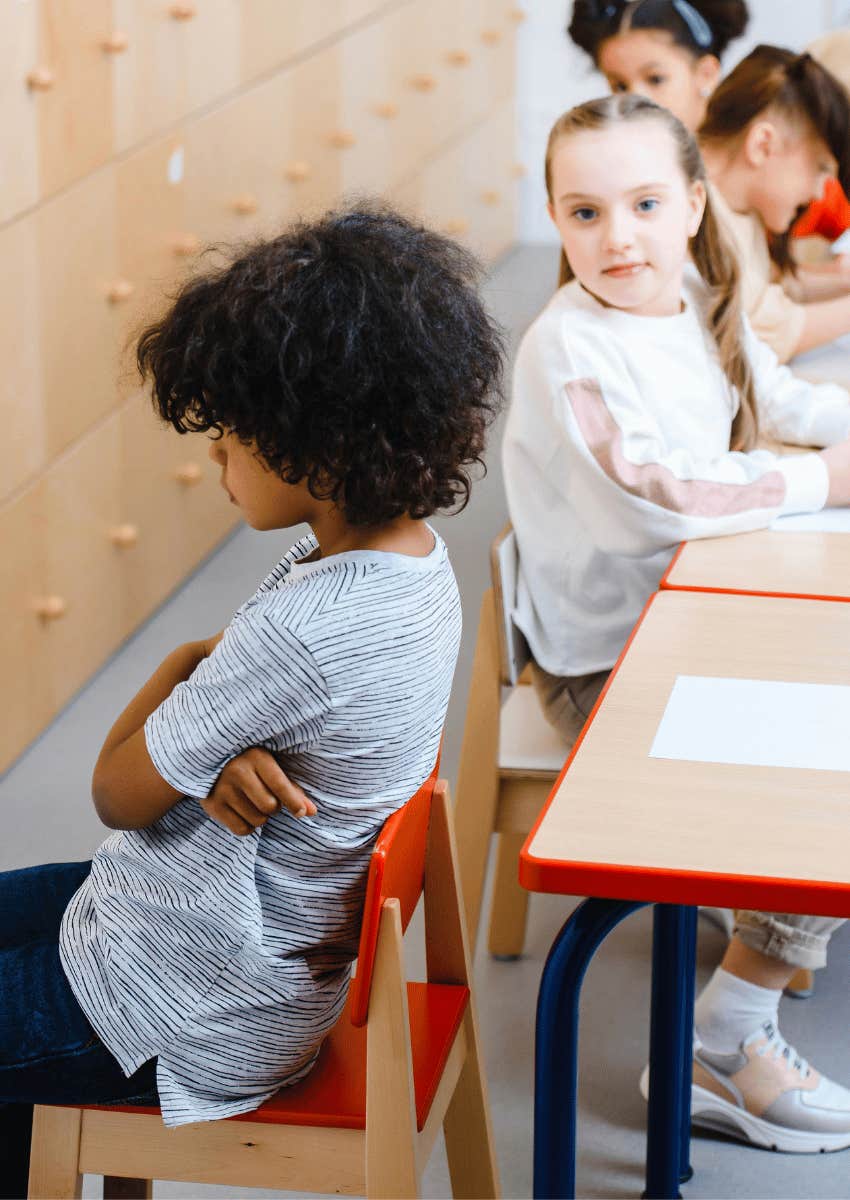 young student turned away in a chair