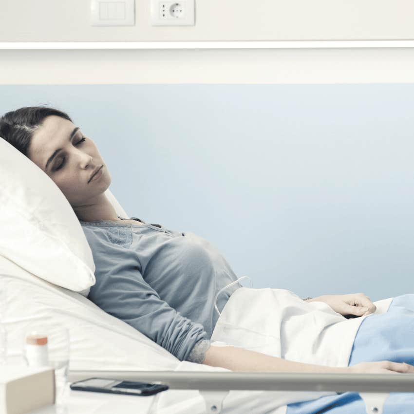 young woman laying in a hospital bed