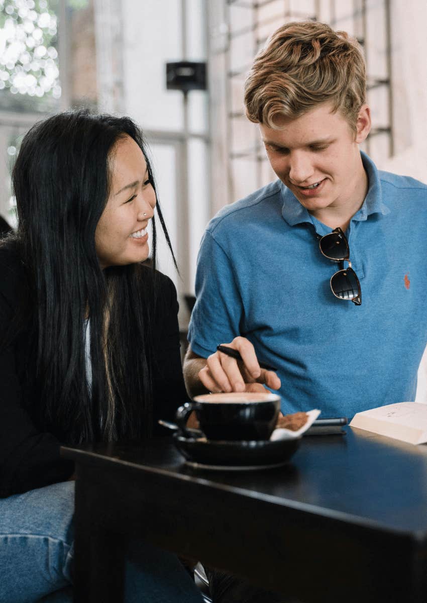 young woman smiling at a kind man