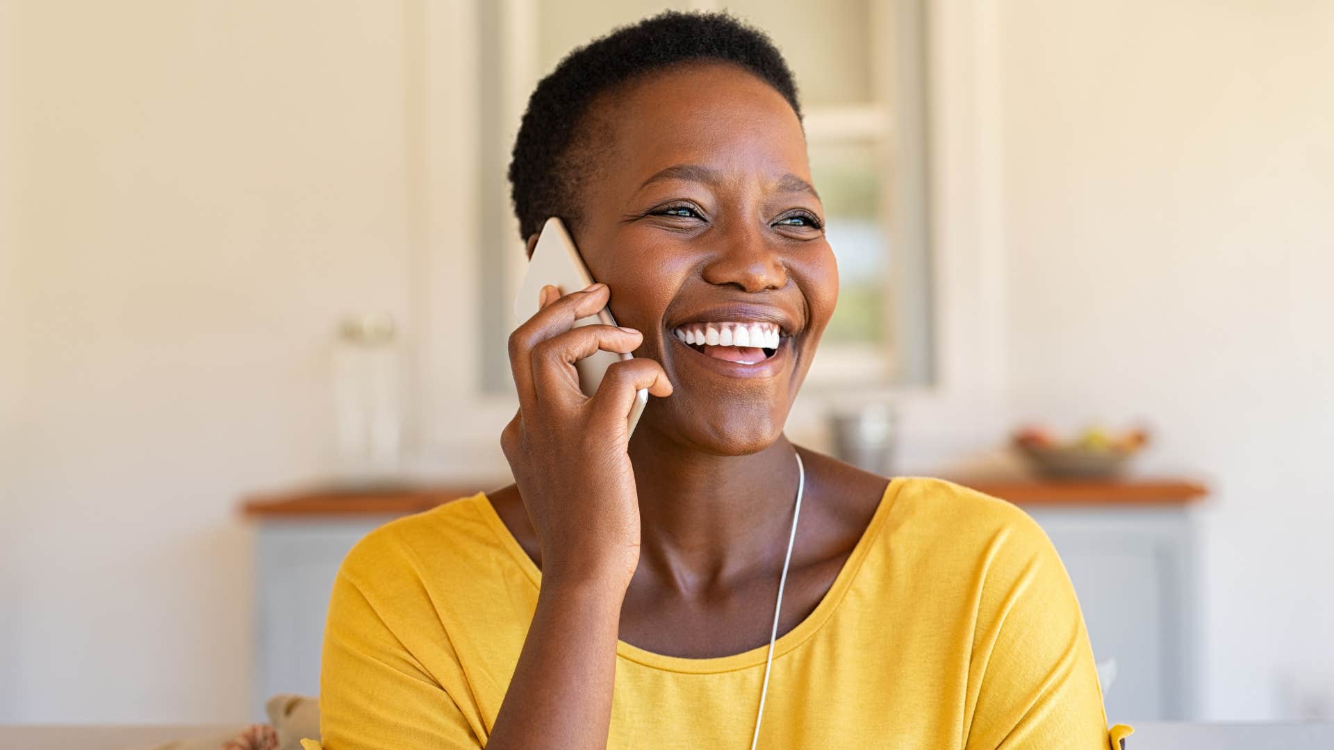 Woman smiling and talking on the phone