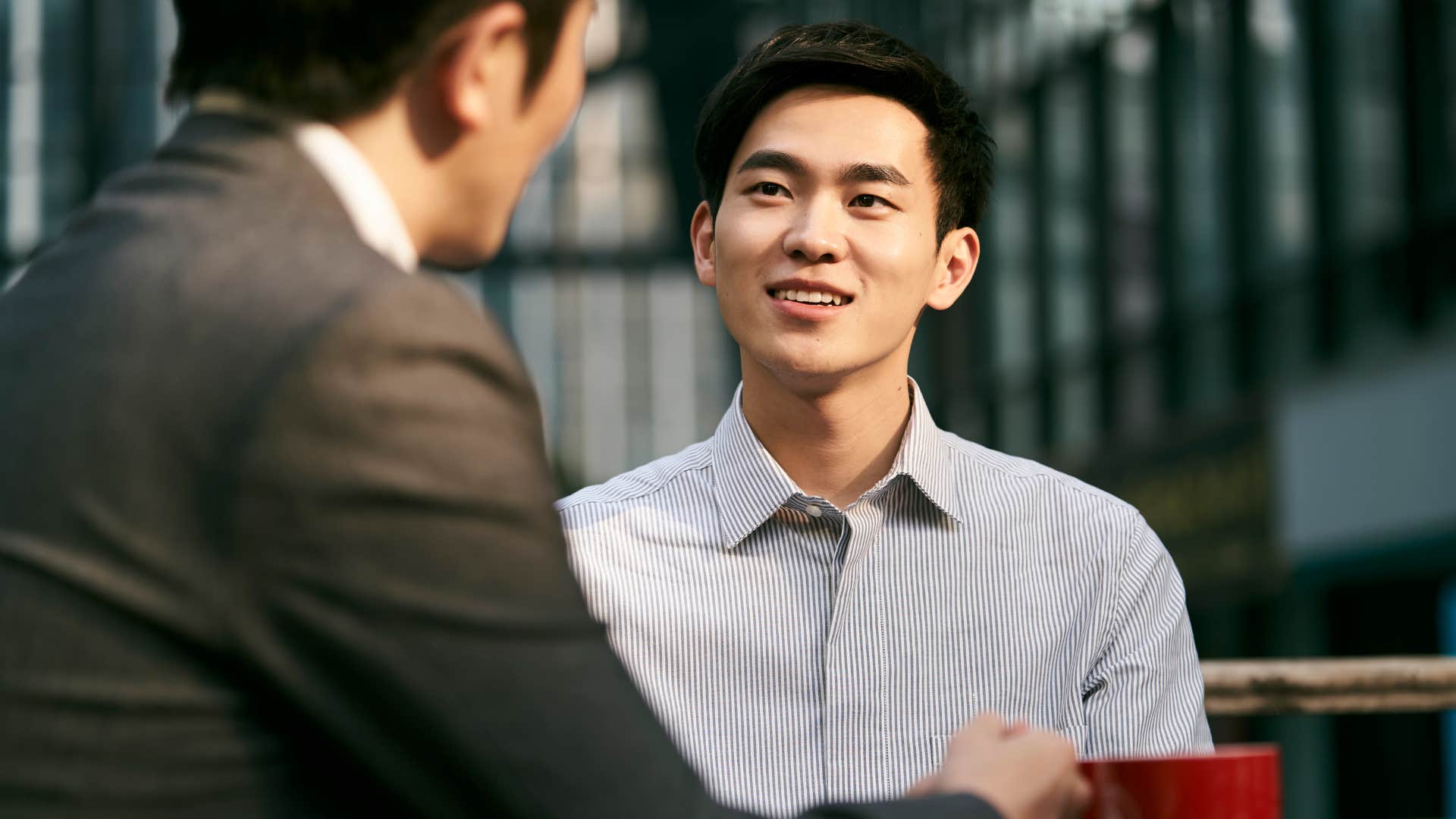 Man listening to his co-worker outside