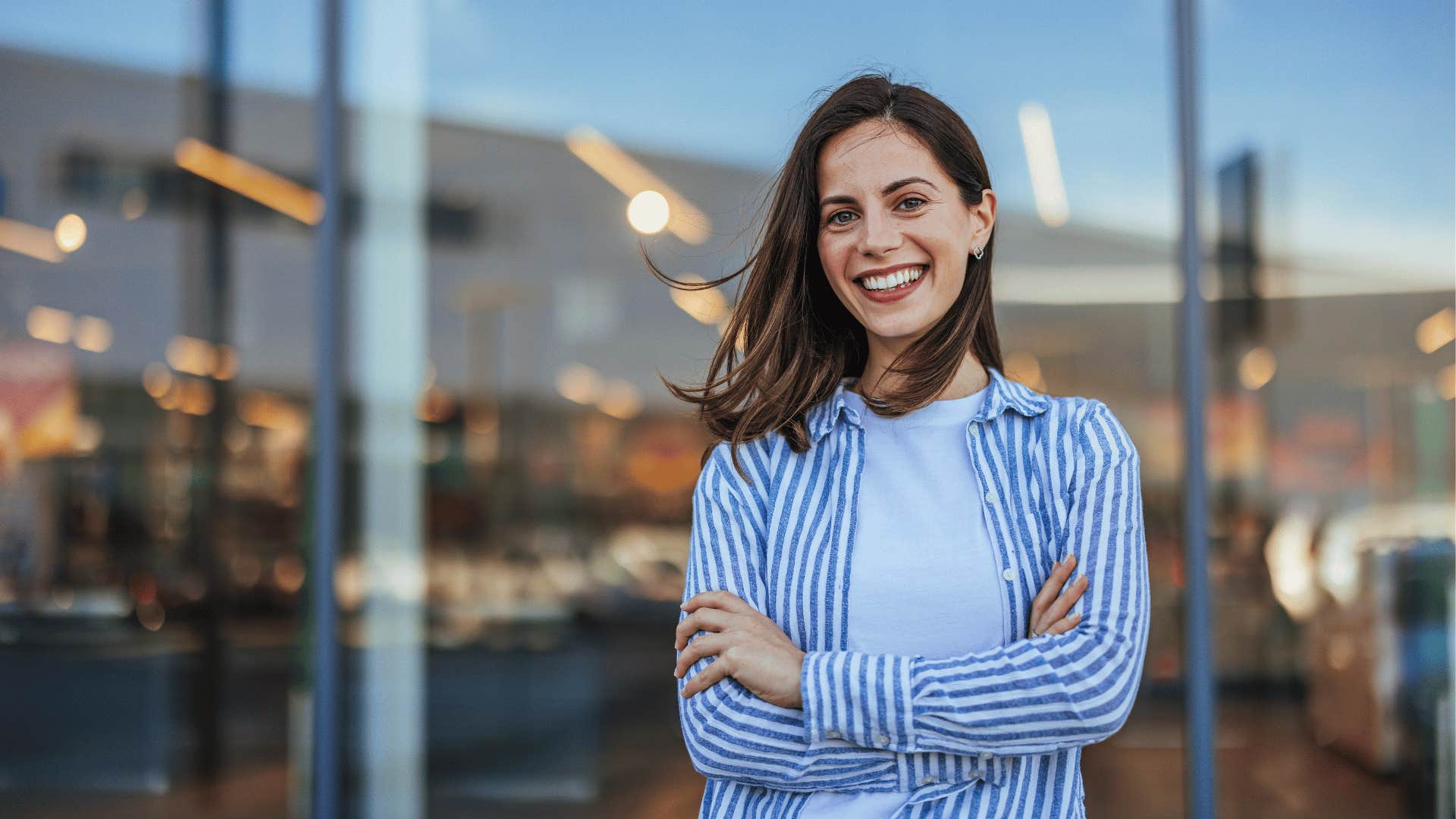 happy woman standing outside