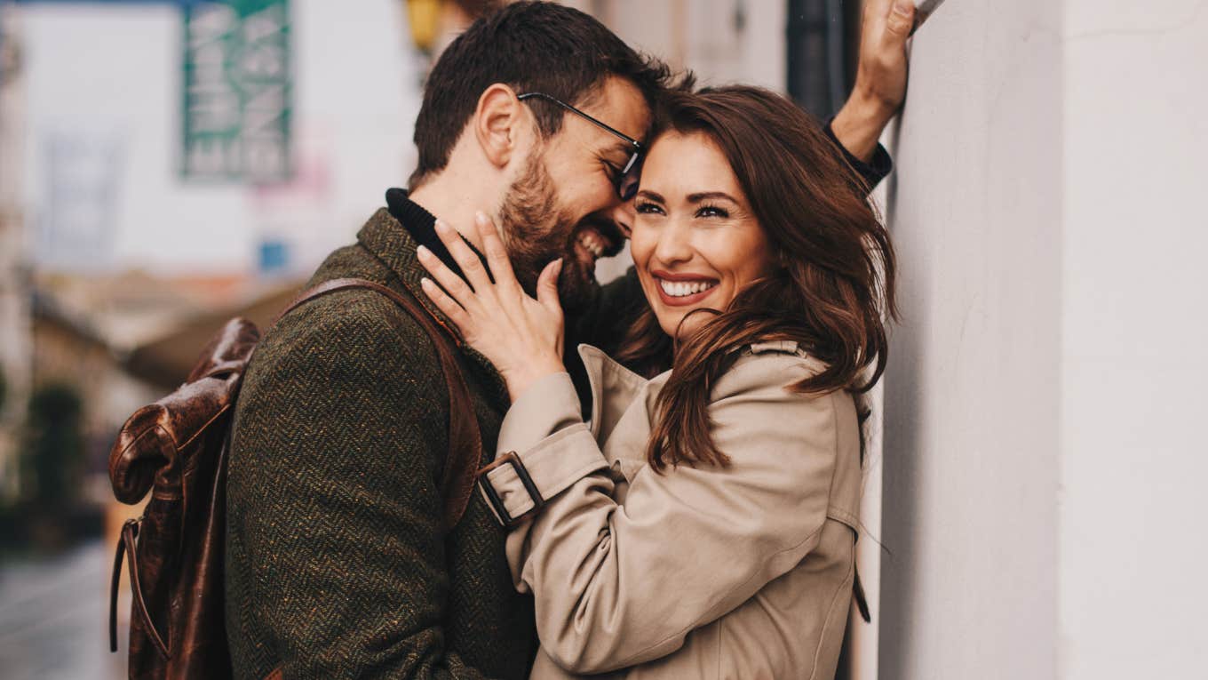 Soulmates embracing in street.