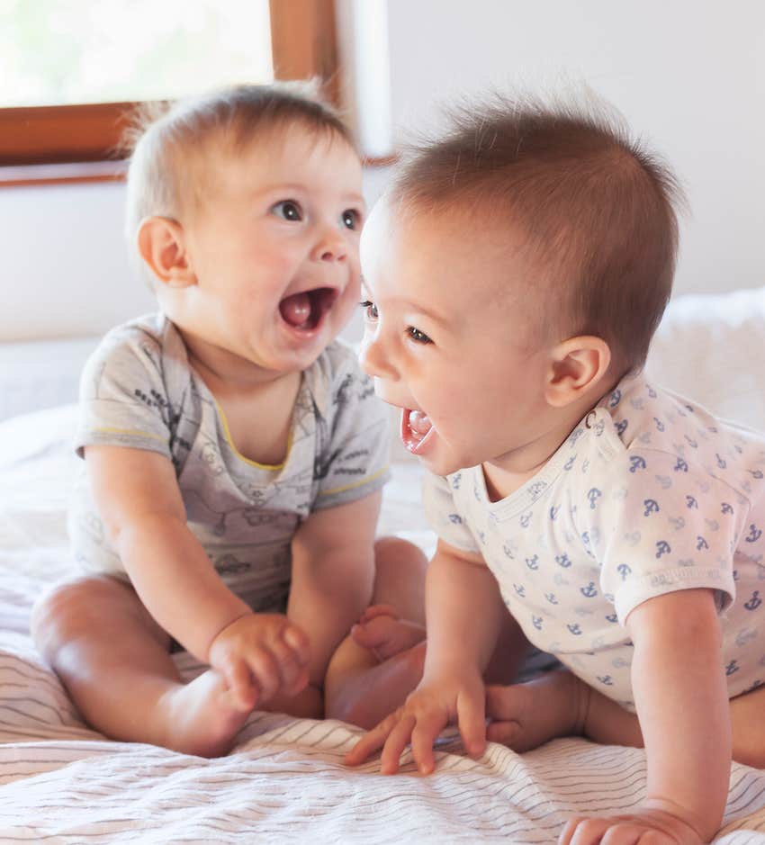 Two babies on bed