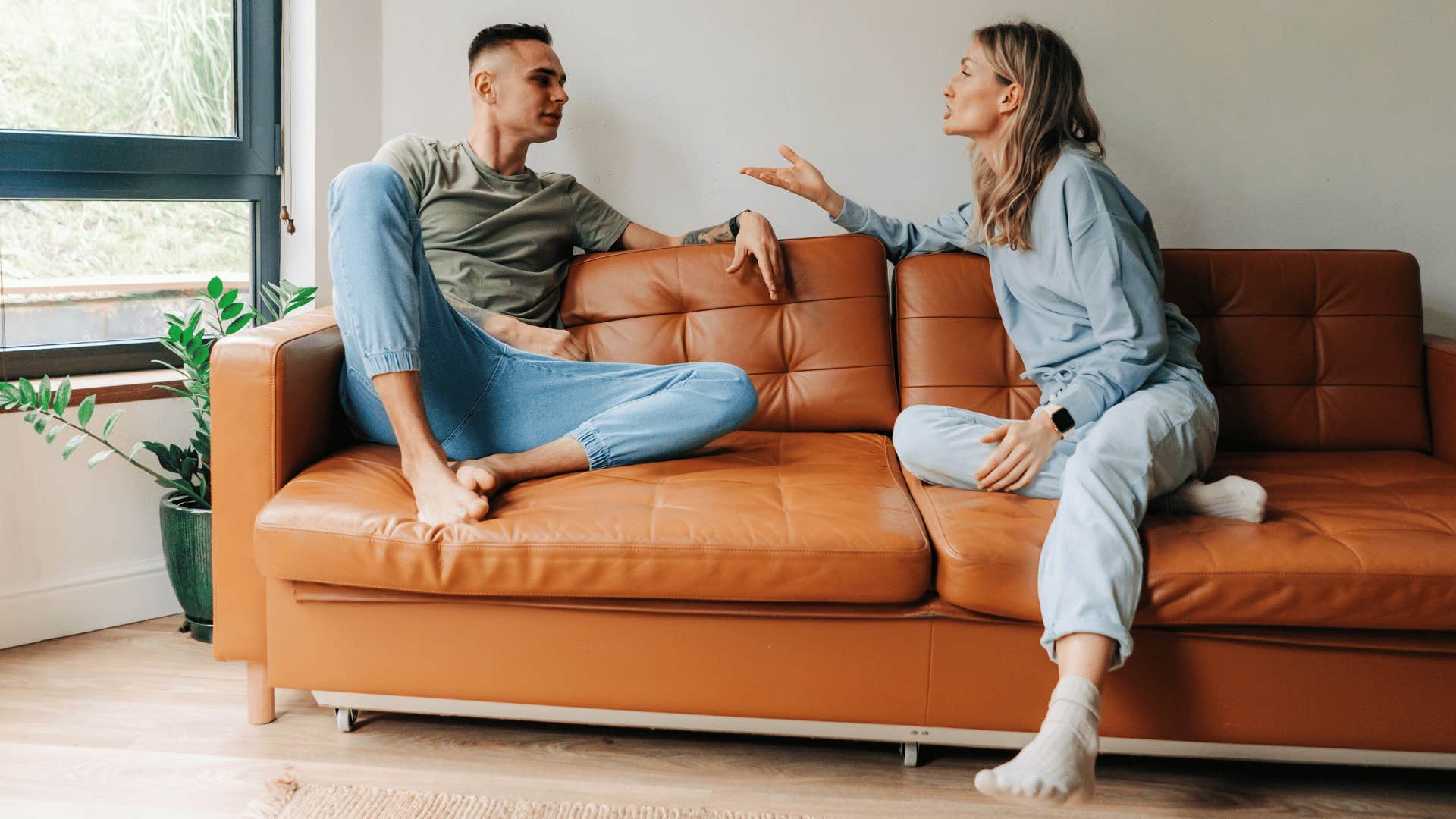 couple arguing on couch